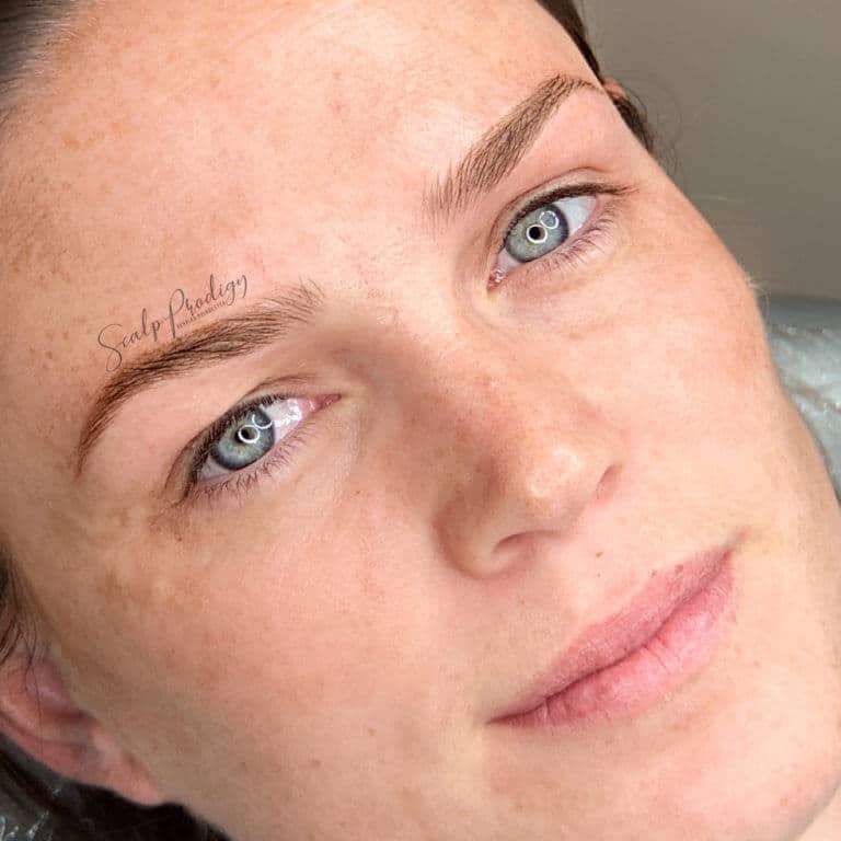 Microblading treatment showcasing natural feather like eyebrows